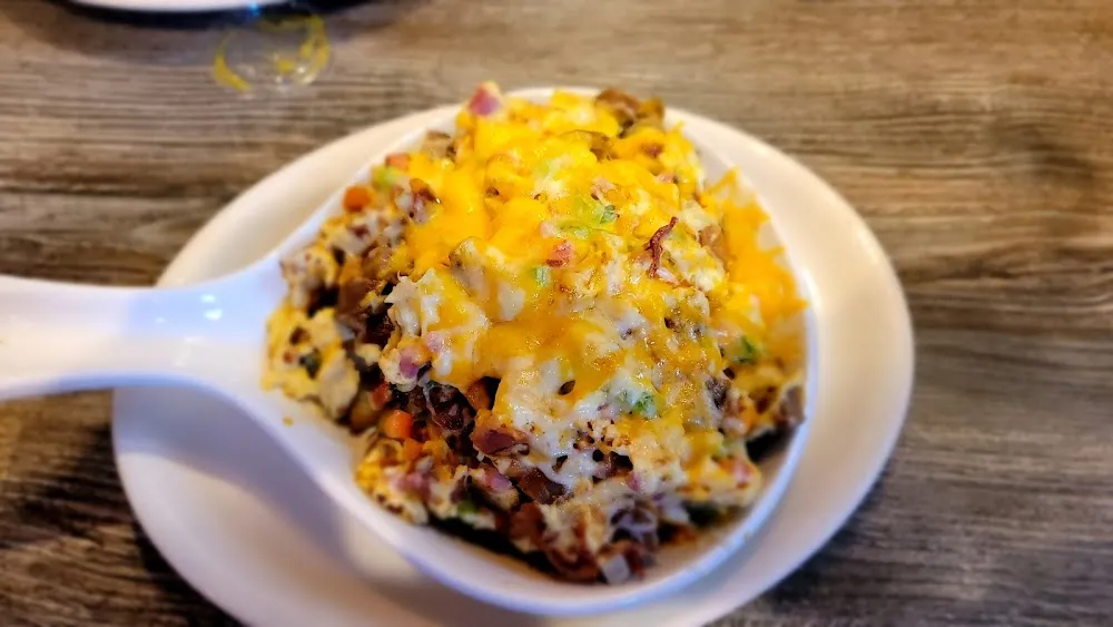 Country Skillet with Ham Bacon Sausage Bell Pepper Onion Tomato and Cheese